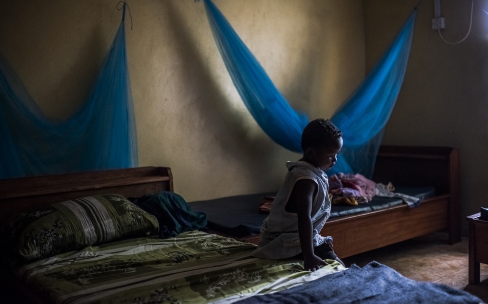   Sweety Sweety, 4, an Ebola orphan in the bedroom that she shares with another orphan, at an Interim Care Centre (ICC) in Port Loco, Sierra Leone. December 06, 2014 © Daniel Berehulak for The New York Times  
