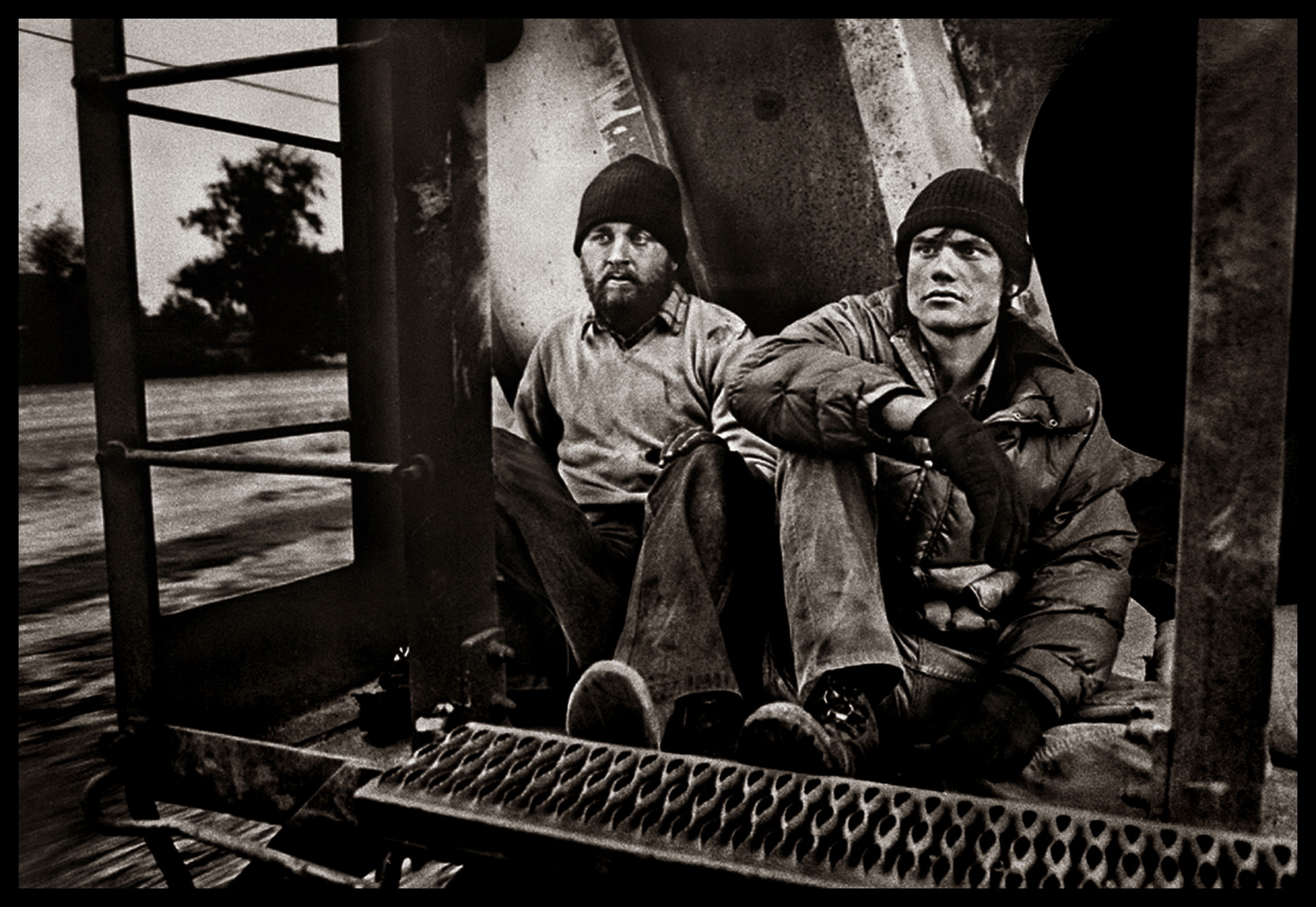 Photographer Michael S. Williamson (L) and writer Dale Maharidge ride the rails near Fresno, California in March 1982. © Michael S. Williamson