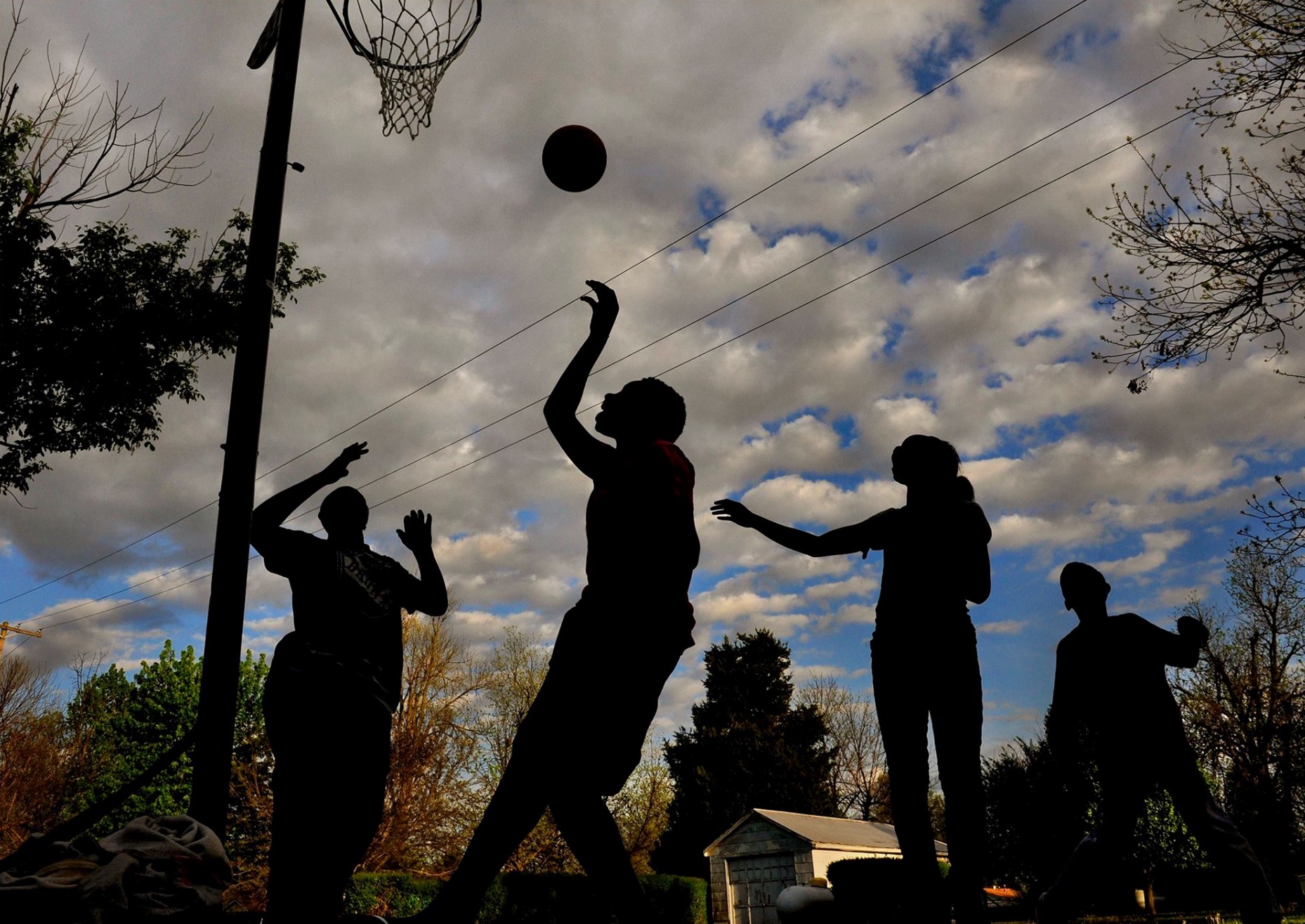 While the new mayor and old mayor and the locals and the media went back and forth over what part of the recent resignations of police and city officials (after an African American woman was elected mayor) was related to race...on a poorly paved street in mixed race neighborhood just 4 blocks from city hall a group of teens played hoops. I didn't want to ruin their playtime by asking political questions but I did ask what THEY thought was the biggest issue in town. Andrew, (the kid shooing in the photo) didn't hesitate: "Man, all we want is a place to play ball and not worry about getting hit by cars." — in Parma, Missouri. © 2015 Michael S. Williamson/The Washington Post