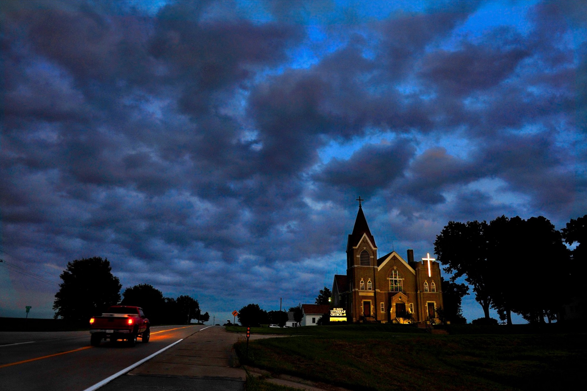 Published stories the past 7 days answered the question some asked, ("What are you working on?") Well, last Sunday the Katrina refugees in Nebraska, and the day after that the President Carter at church story and this morning the nice spread on car culture was in the paper: I connected the three (Nebraska-church-road pic) with this church photo from the Nebraska story. Seemed like Sunday would be a good day to post this. — in Falls City, Nebraska. © 2015 Michael S. Williamson/The Washington Post