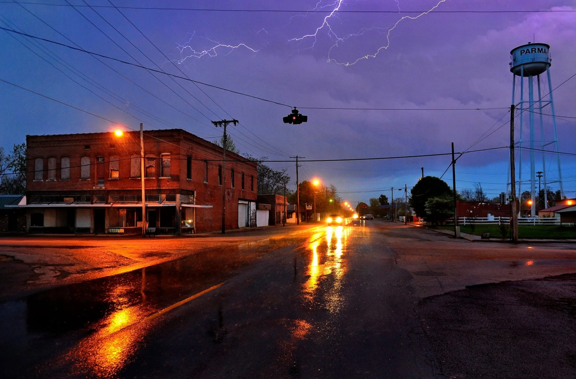 Small middle-of-nowhere town. Check. Funky abandoned buildings. Check. Rainstorm for cinematic effect. Check. Flash fill supplied by nature. Check. All is well in Parma, Missouri. © 2015 Michael S. Williamson/The Washington Post