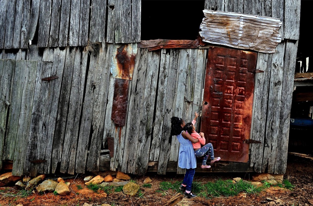   A curious Juliet Pace (age 4) and her cousin Campbell (age 7) got quite a history lesson on Monday as they visited a nearly forgotten slave cemetery where some of their relatives are buried. They also explored a restored slave shack on the grounds 