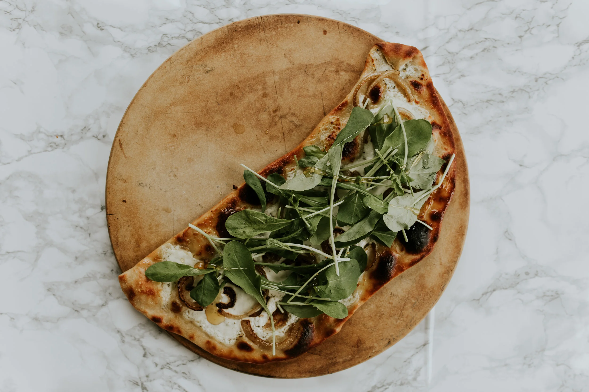 recipe. goat cheese, onion, arugula, honey flatbread