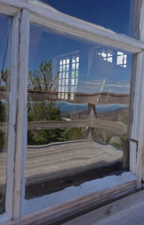 The front windows, with many small panes, still held the old wavy glass.