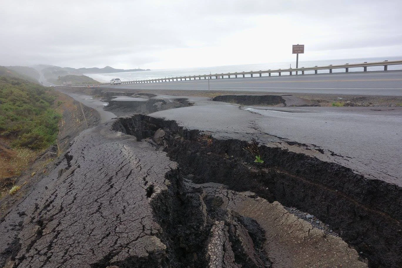 An abandoned section of very bad pavement (due to continuing landslide) on Hwy 101 north of Newport.