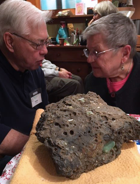 Larry and Bev confer next to the Christmas rock found in the Columbia Gorge by Cris. 