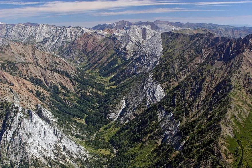 The walls of Eagle Creek Canyon are papered with alternating bands limestone and sandstone from the Martin Bridge and Hurwal Formations. Photo by Ellen Morris Bishop.