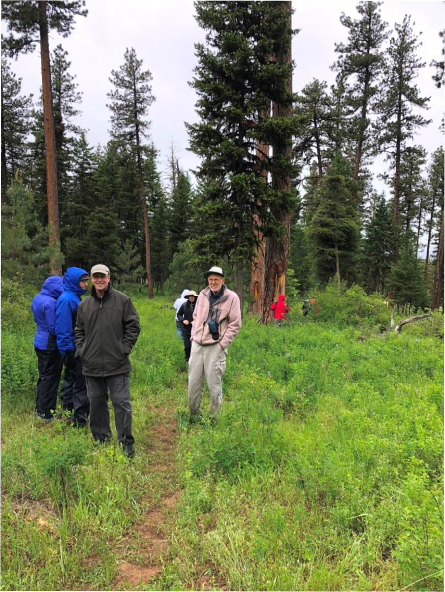 The field trip guide for this part of the trip was photographer Dave Jensen (tan outfit in the center), who took the group to a grove which was an ancient camp of the Nez Perce tribe.