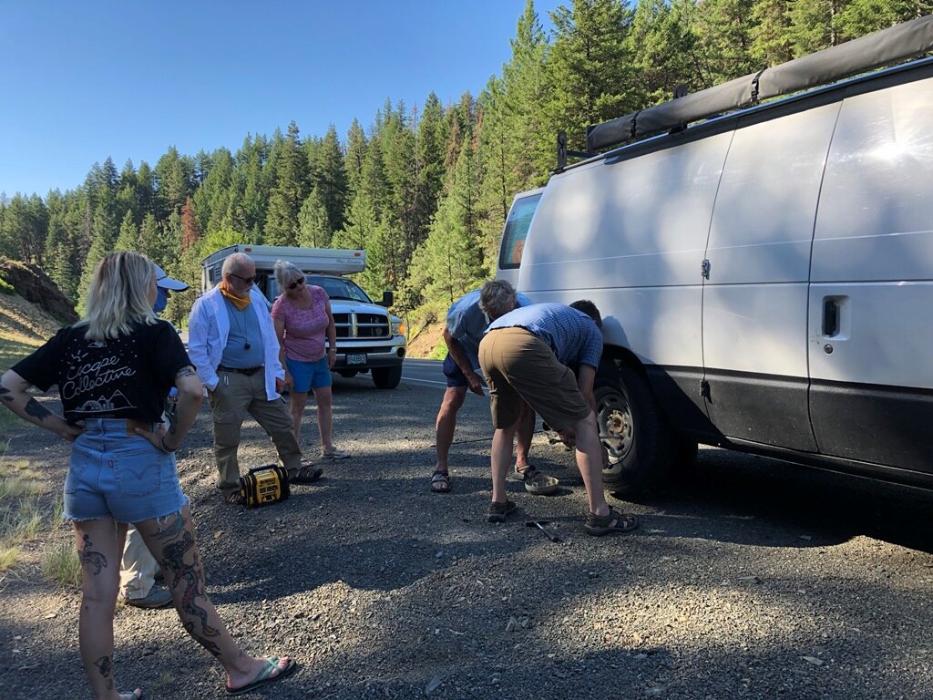  Pit crew to the rescue on a flat tire heading north to stop 1 on day 3 