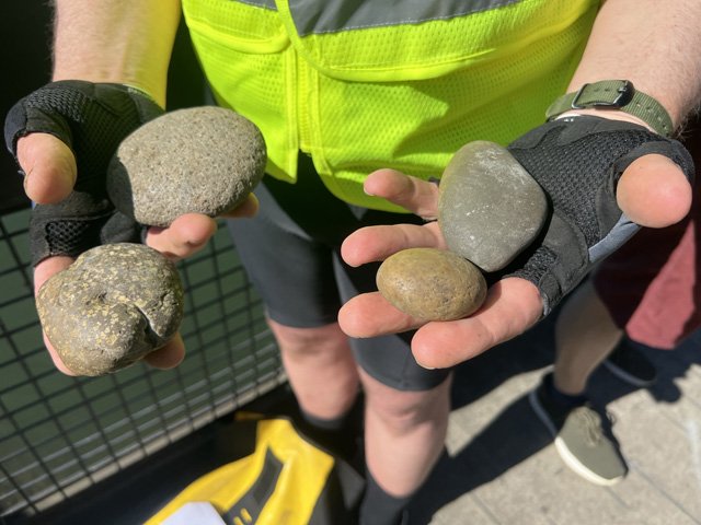  Ian shows the group examples of Cascade porphyry, Boring lava, Columbia River Basalt, and quartzite he has found on the bank. 
