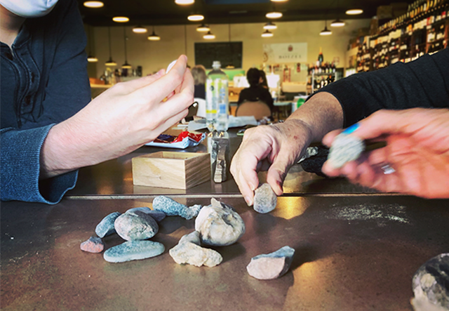 Woodstock Deli Meetup hands with rocks - 640 1.png