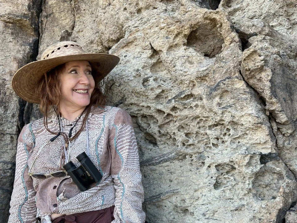  Christina standing next to a section with tafoni weathering. 
