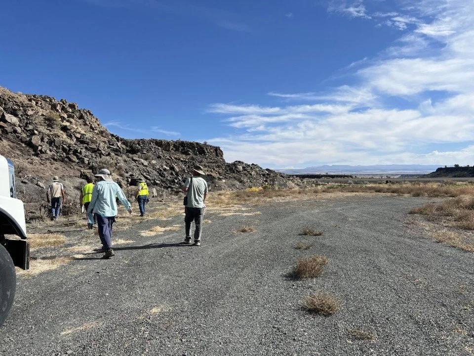  The group examining boulders of material from the hill. 