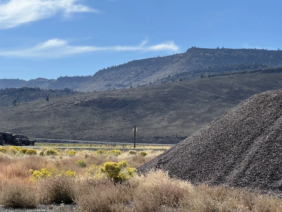 Looking south to a faulted block and the wall of Steens Basalt beyond. 