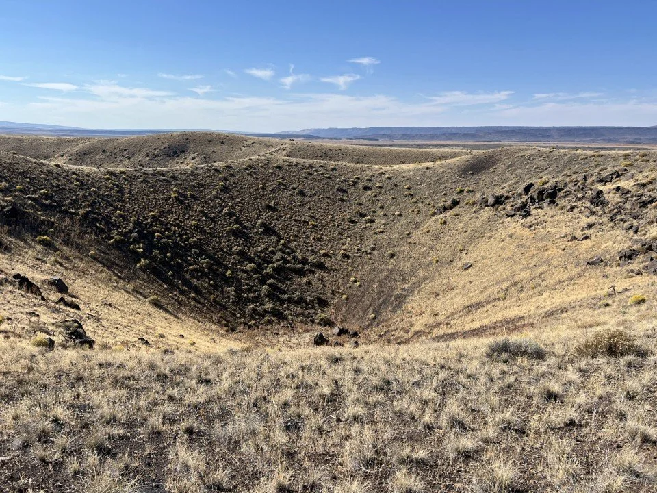  An explosion crater skirted by the group. 
