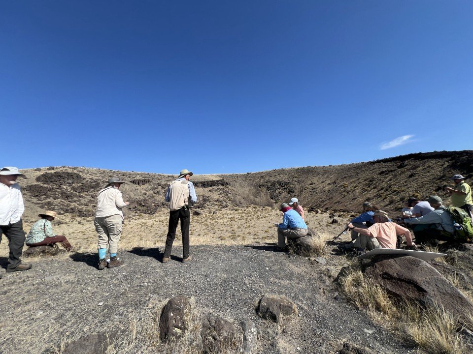  The group contemplates East Twin Crater. 