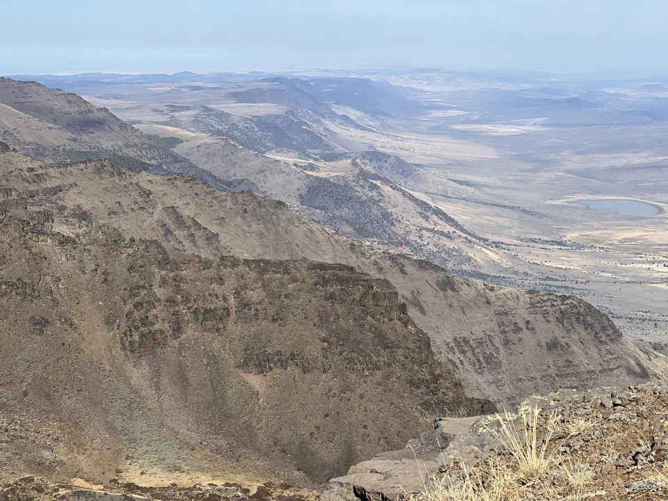  The steep eastern wall of the Steens is beribboned with lava flow upon lava flow. 