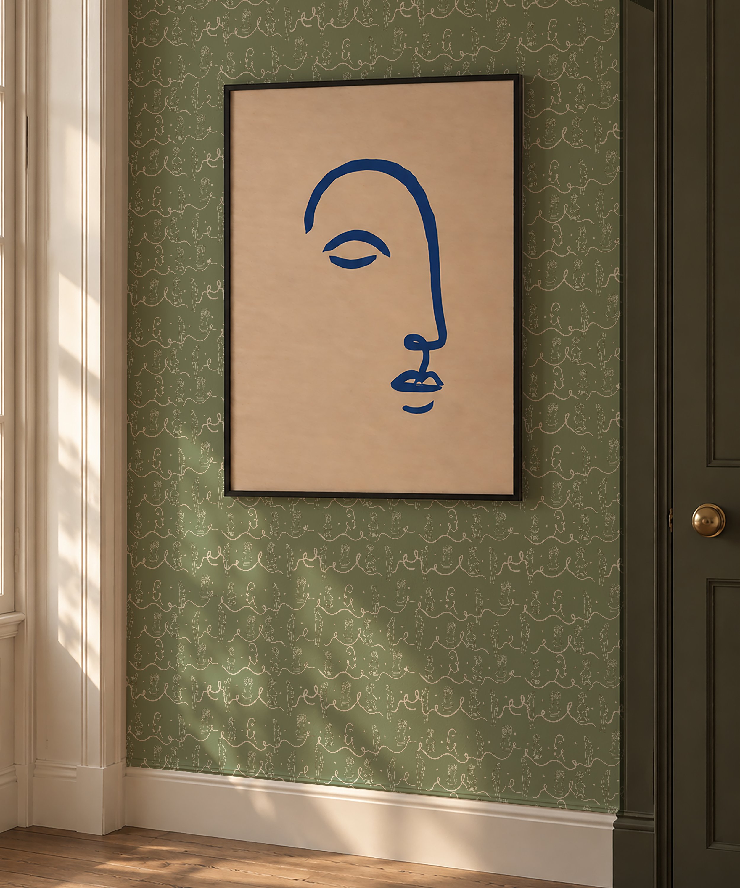 face 2 in frame_on wall with squiggle olive paper.jpg