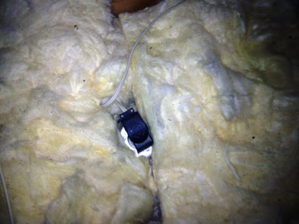 Fire hazard - insulation around downlight where there should be clearance