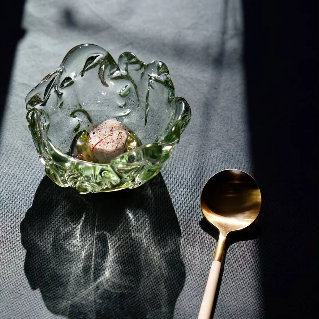 Our recycled glass bowl SKVULP at the lovely @luciole.restaurant 🌱 in Switzerland.
__
@luciole.restaurant 
M A O  T O F U &times;  S A F R A N

Hairy tofu, tofu velu, stinky tofu - iod&eacute; et umami &agrave; souhait! Servi dans son consomm&eacute