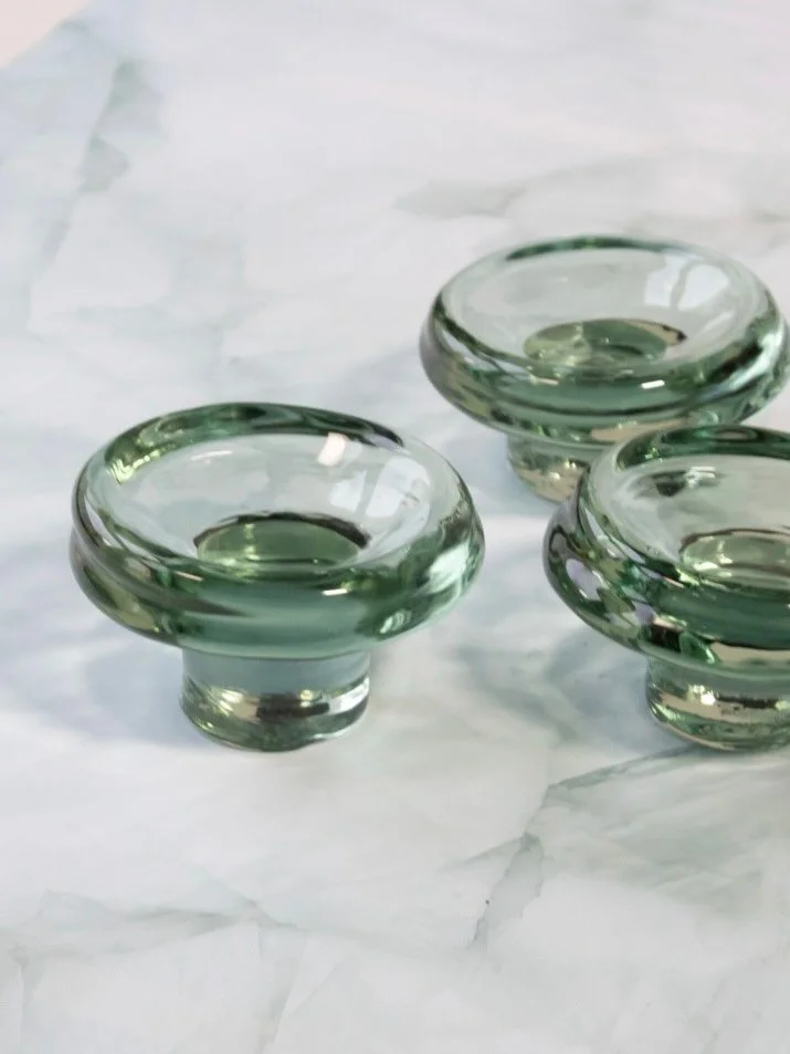 Say hi to our new (but recycled!) glass pedestal plate STETT! 

STETT is a small and thick pedestal plate made from 100% recycled glass. The inside has a nice even curve around which the glass has been allowed to express its free will, making each pl