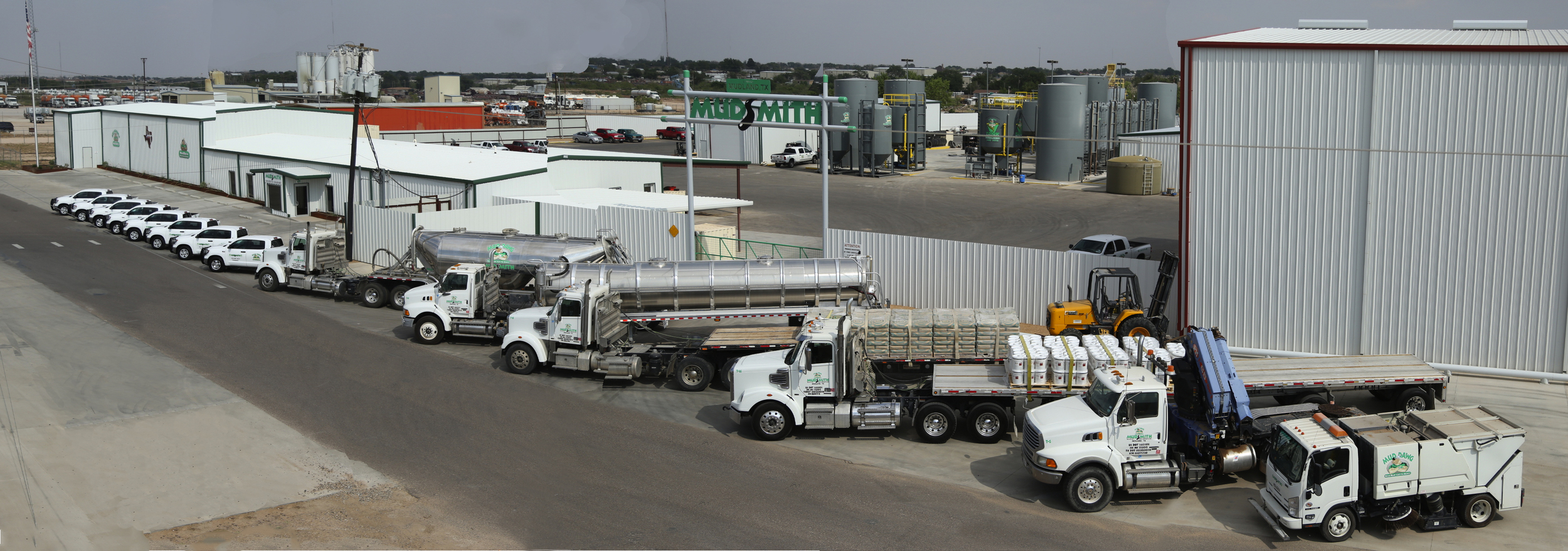 Mudsmith's fleet contains many different types of vehicles from pneumatic and vacuum trailers, to flatbeds and knuckle-boom Crane trucks.