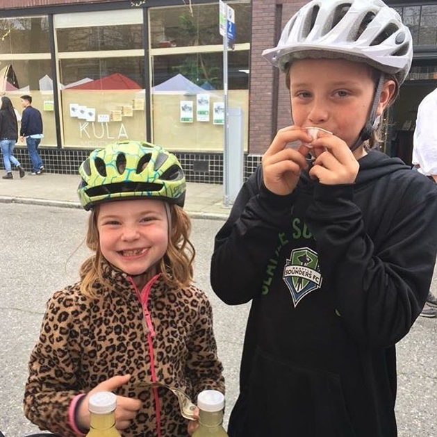 Happy visitors at the Ballard Farmers Market! Using their allowance money to purchase our brine.