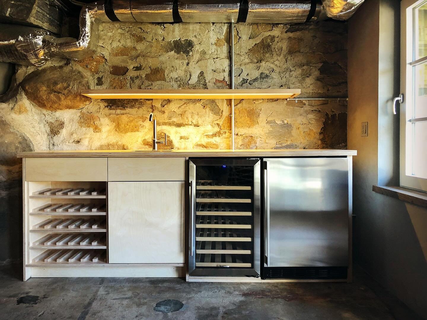 The wet Bar from our Speakeasy project a few years ago. This space is chock full of character. 

- designed by @blockdesignbuild 
- built by @blockdesignbuild

#wetbar #designbuild #moderndesign #speakeasy #blockmdrn #modern #rusticmodern #winecellar