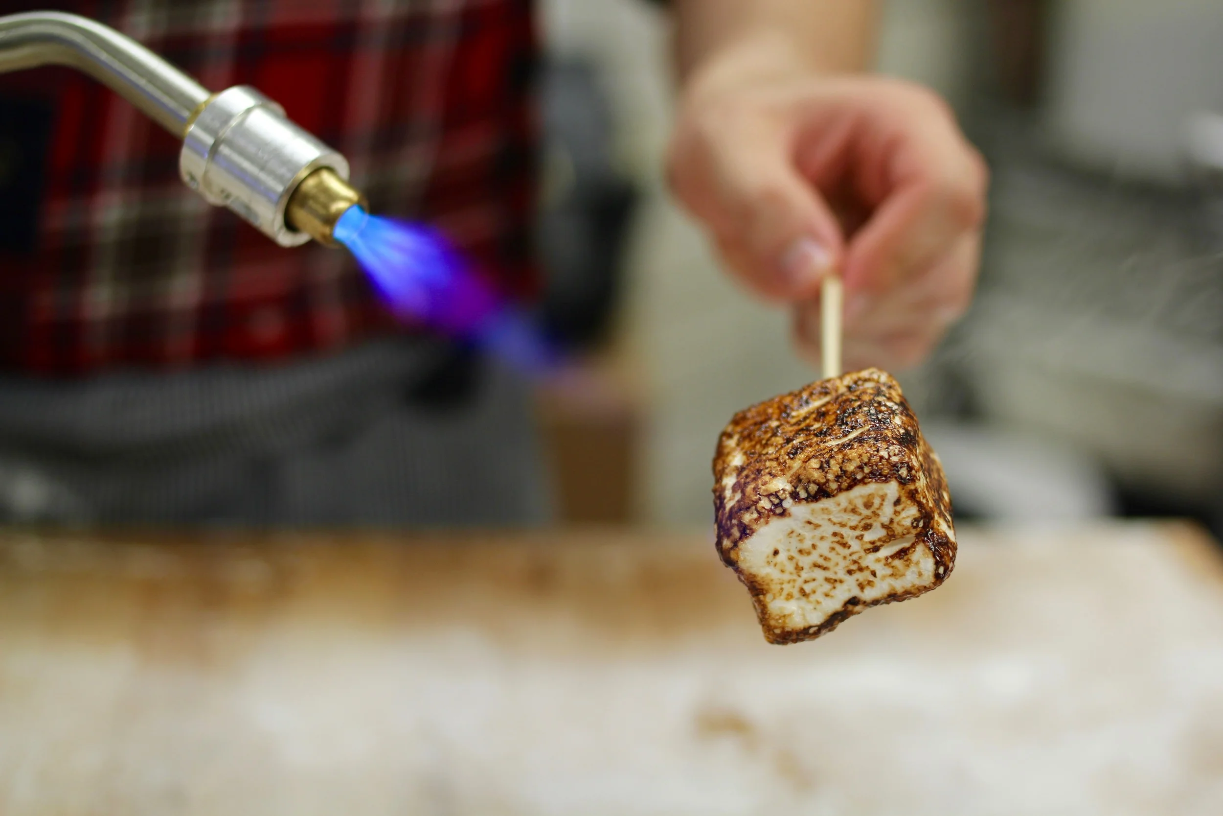Benjamin fires up a marshmallow for me to sample. Photo by Emma Frisch