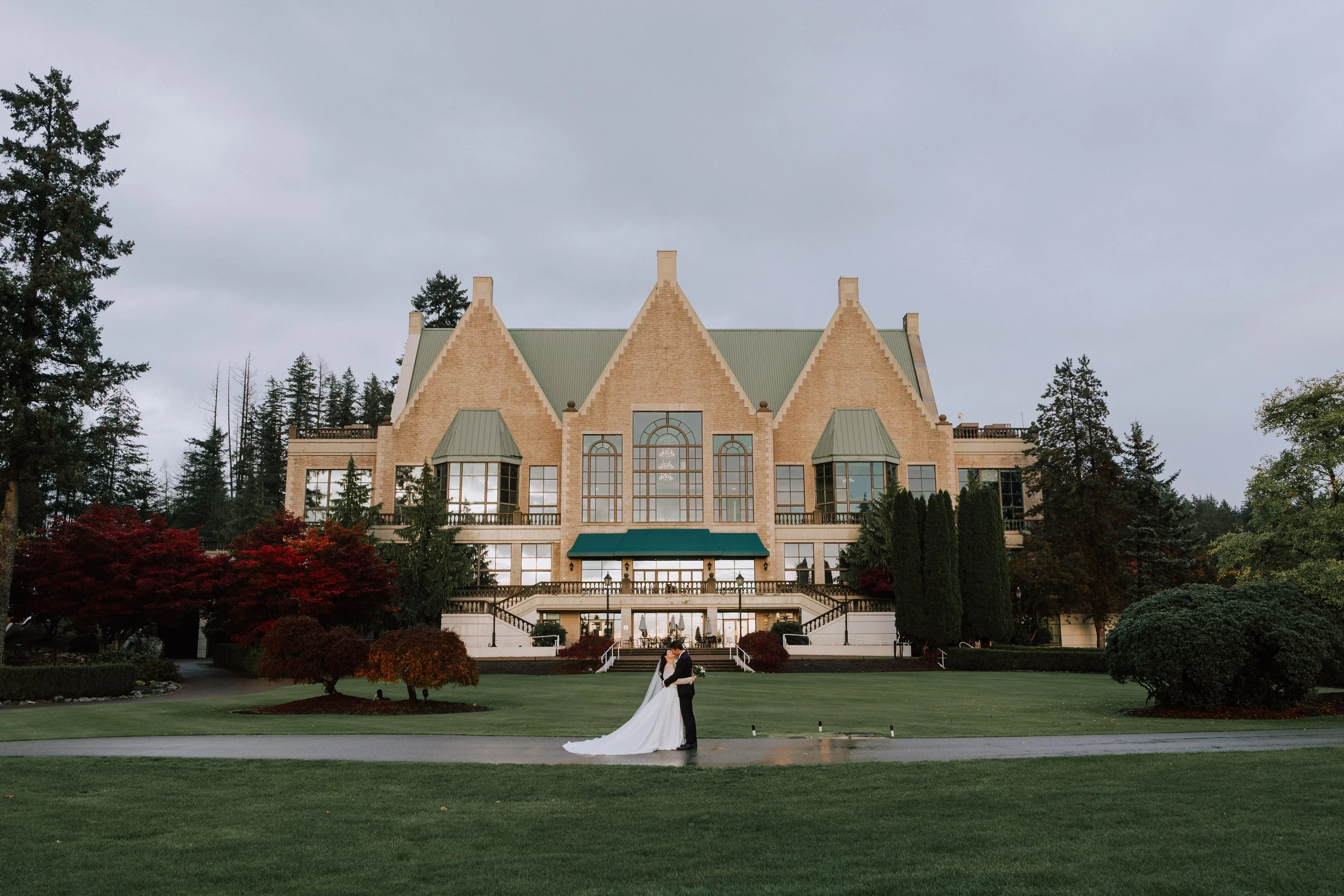 Bride and groom portraits in front of Swaneset Bay Resort & Country Club in Pitt Meadows, British Columbia.