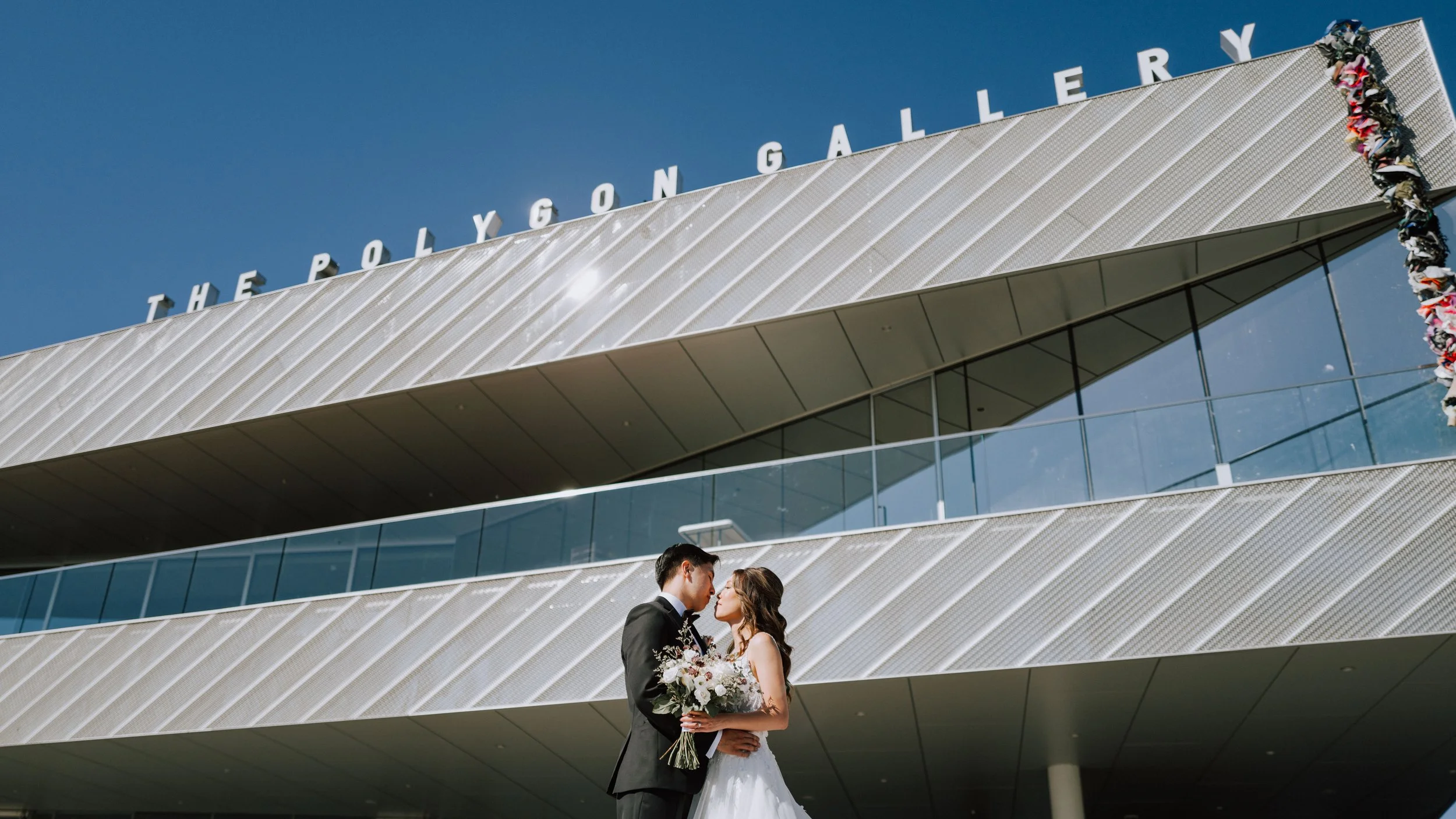 Bride and groom portraits outside The Polygon Gallery in North Vancouver.