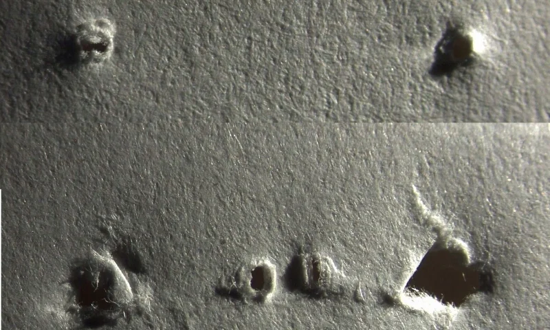 staple holes on adjacent pages in a document