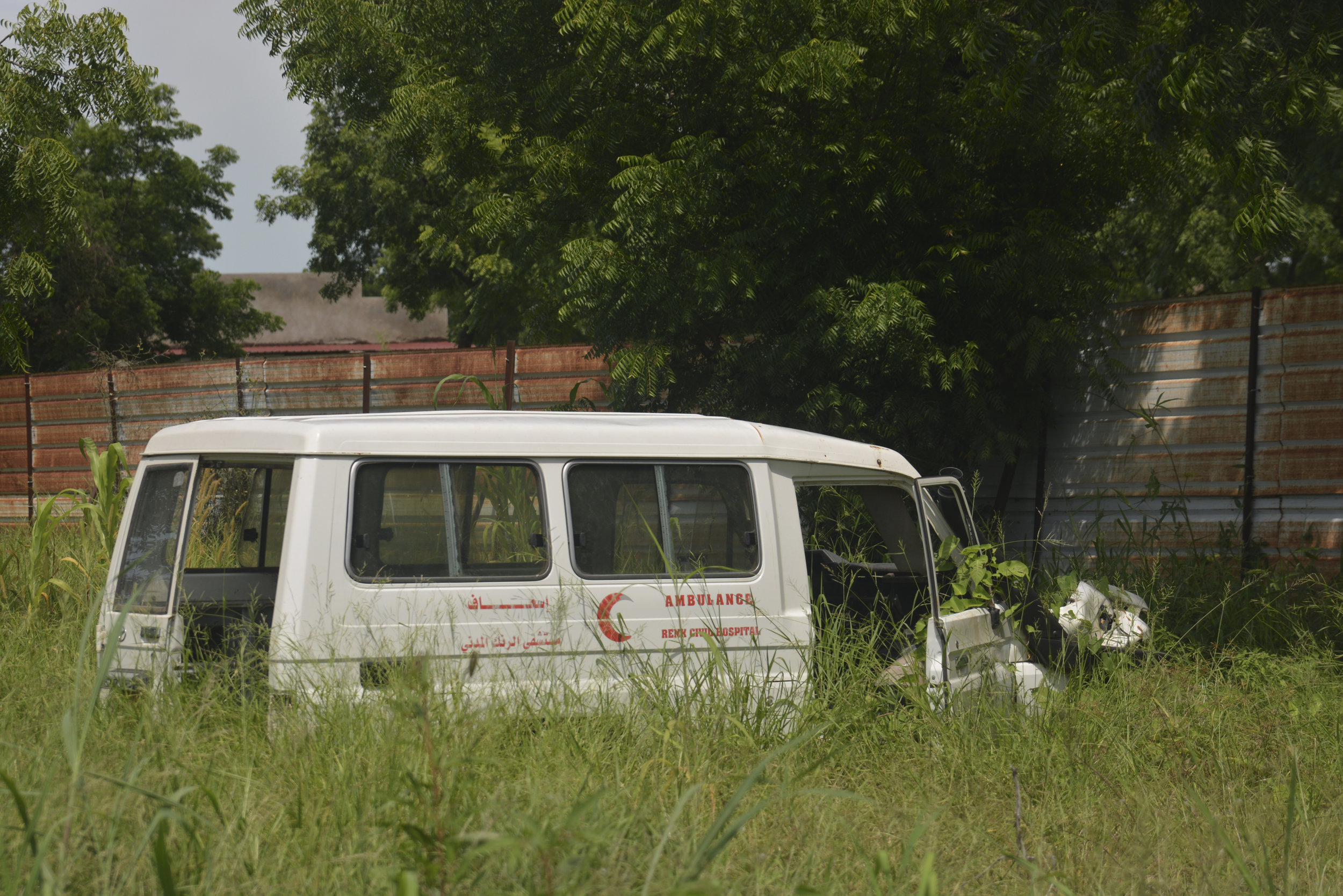  Violence against medical facilities is common in South Sudan and exacerbates the problem of malnutrition. Here, a Renk Civil Hospital ambulance sits stripped and abandoned next to the State Ministry of Health building in Malakal.&nbsp;James Sprankle