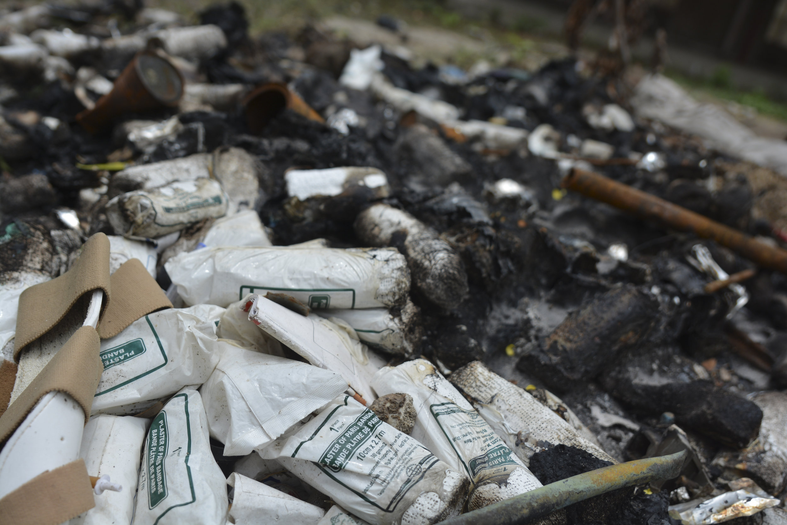  Bandages and other medical supplies cover the ground of the Malakal Teaching hospital. Damaged during an attack on the hospital, the supplies were actually burned by the medical staff because they were no longer sterile. (Photo by James Sprankle/For