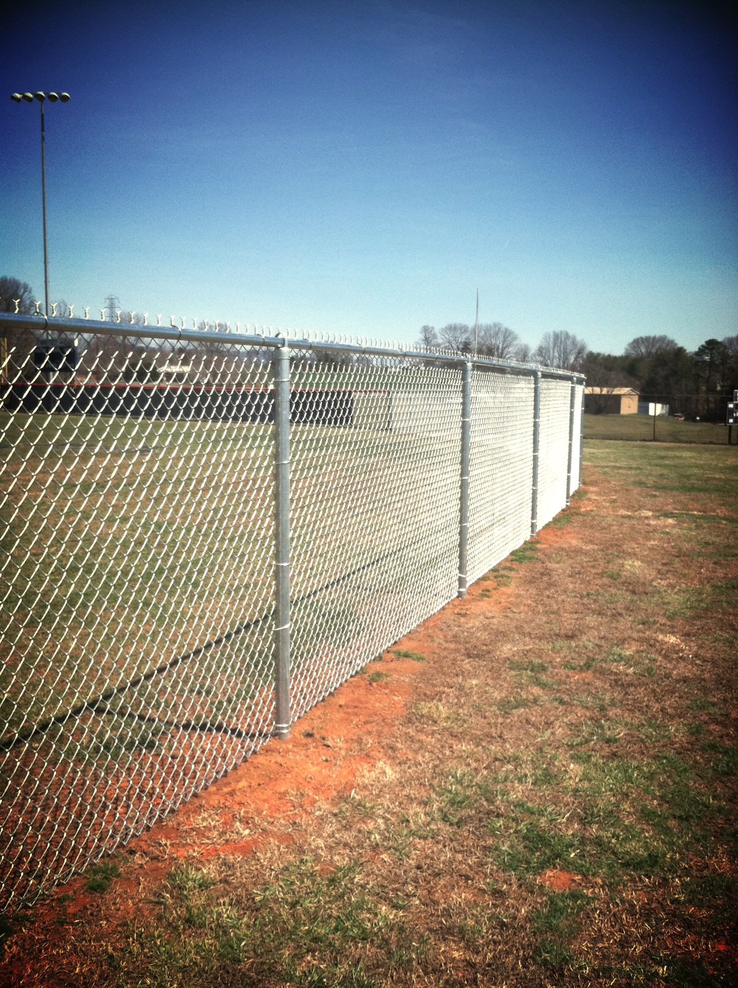 6' High Chain Link Softball field fence at Liberty H.S. in Bedford