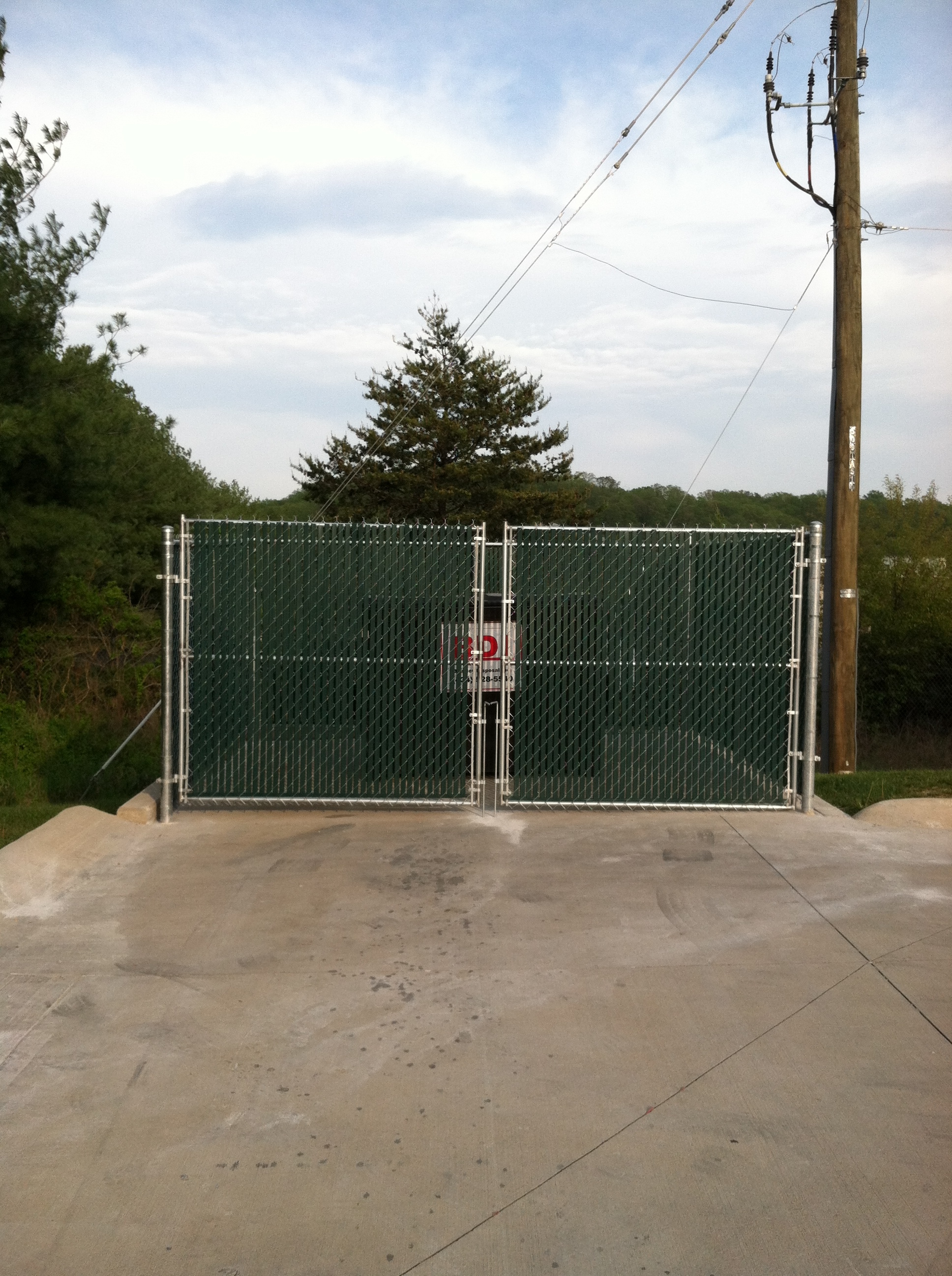 Chain Link Fence With Green Privacy Slats @ O'Reilly's Auto Parts Alta Vista VA