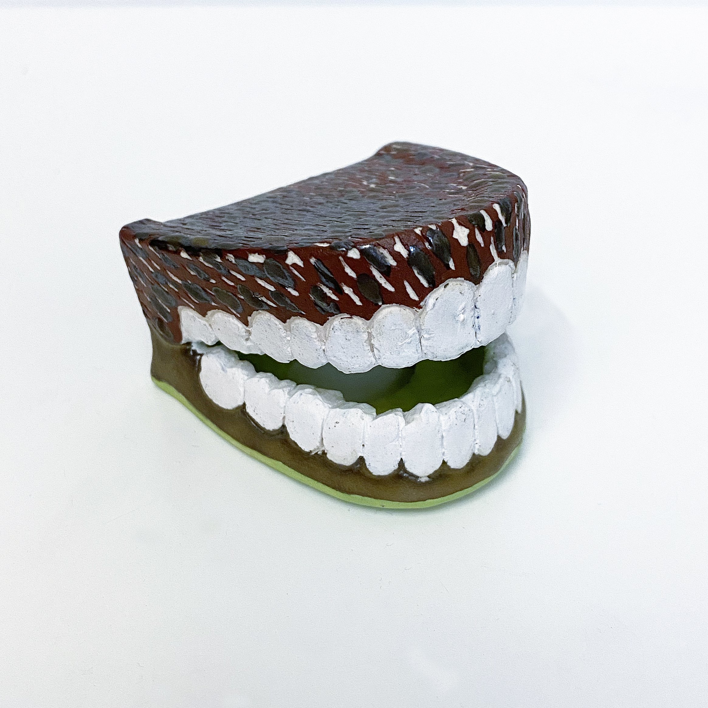 Chattering Teeth: Scratching At Bone Gold Turned Green by Neglect (Copy)