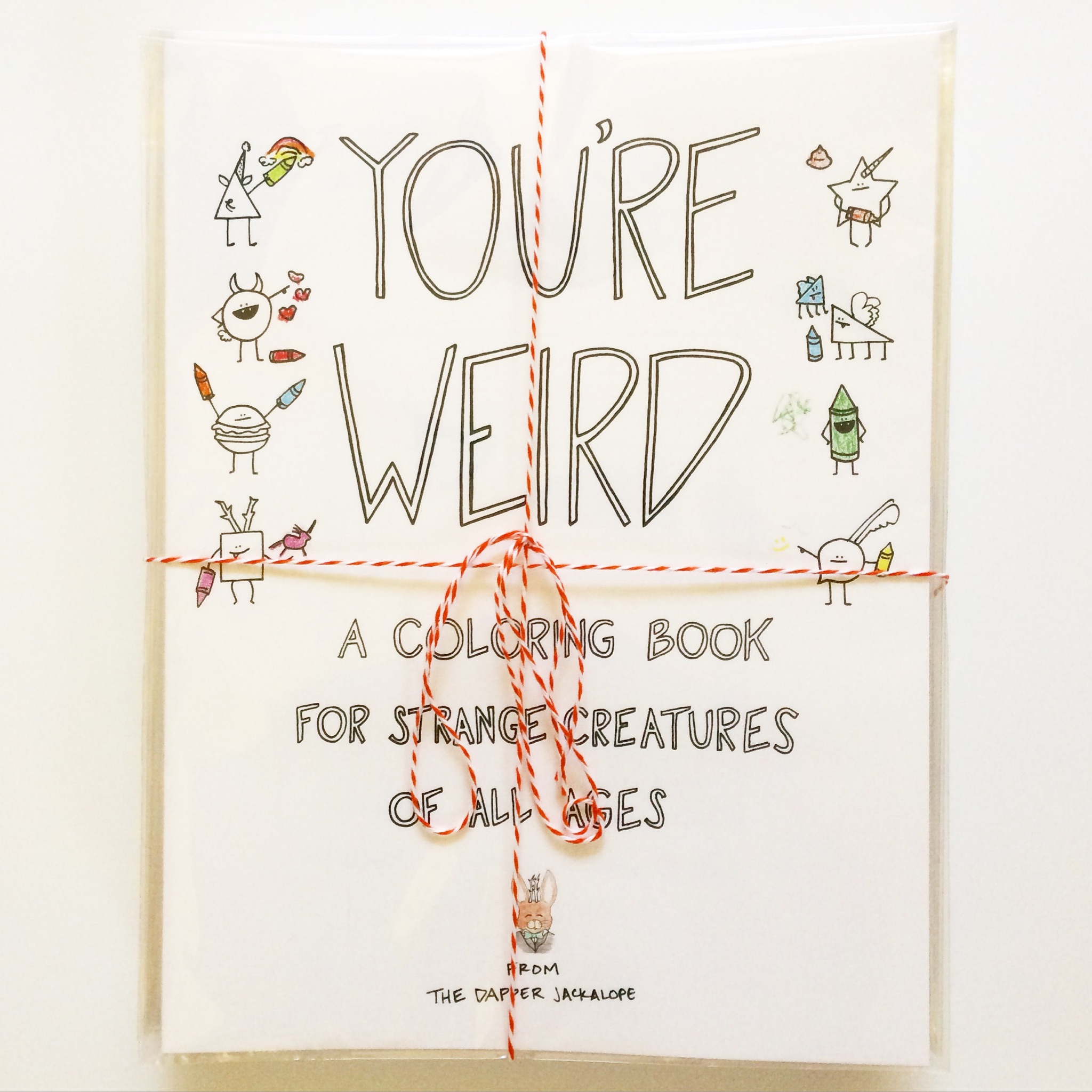 This fat stack of coloring books now lives in their adorable store in Wisconsin!