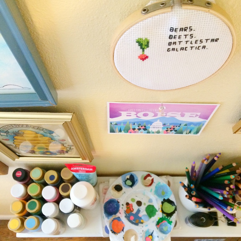 The crossstitch in this photo is from Snitches Get Stitched , the Boise postcard is from Melanie Folwell , and the beehive print is from Jesiiii .