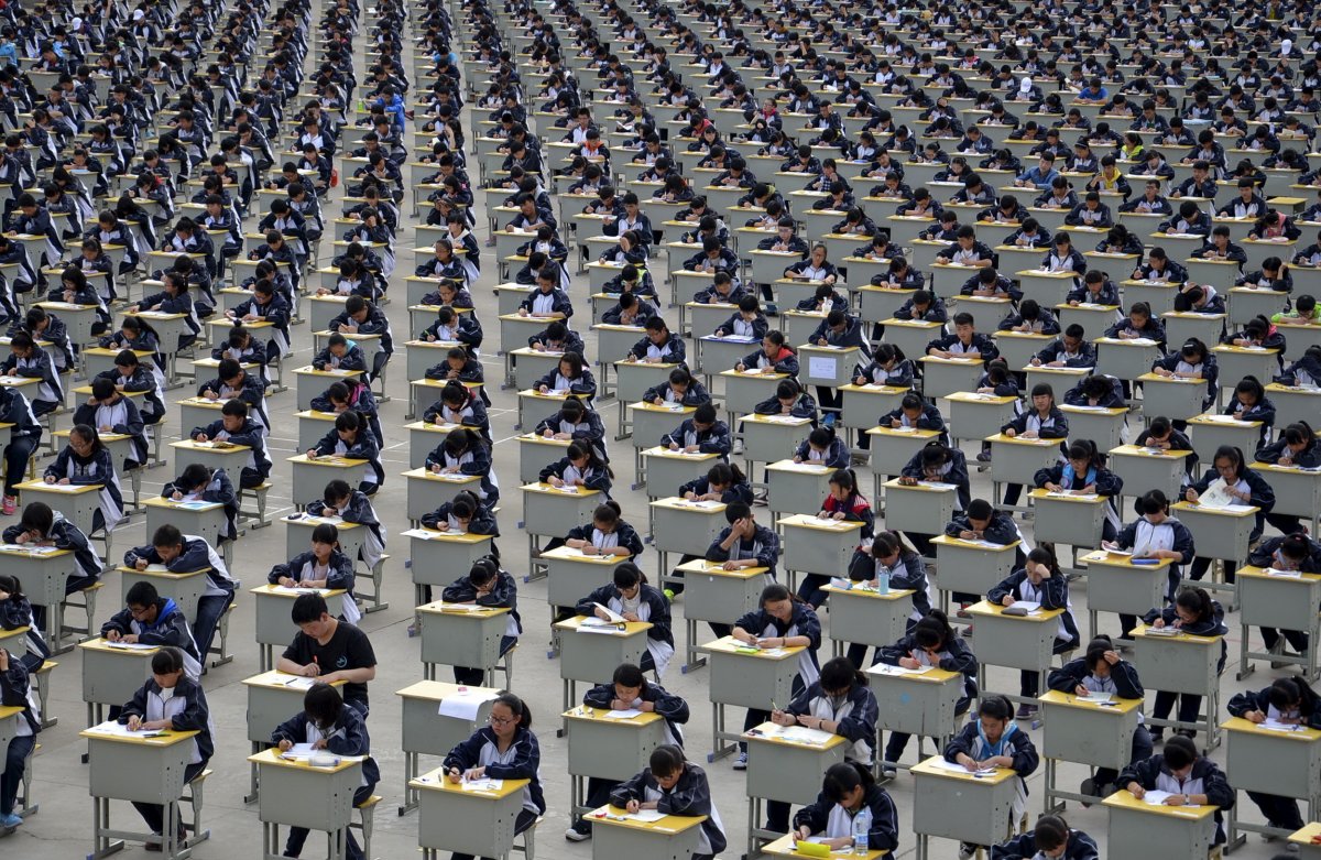 Students take an examination on an open-air playground at a high school in Yichuan, China, on April 11, 2015.