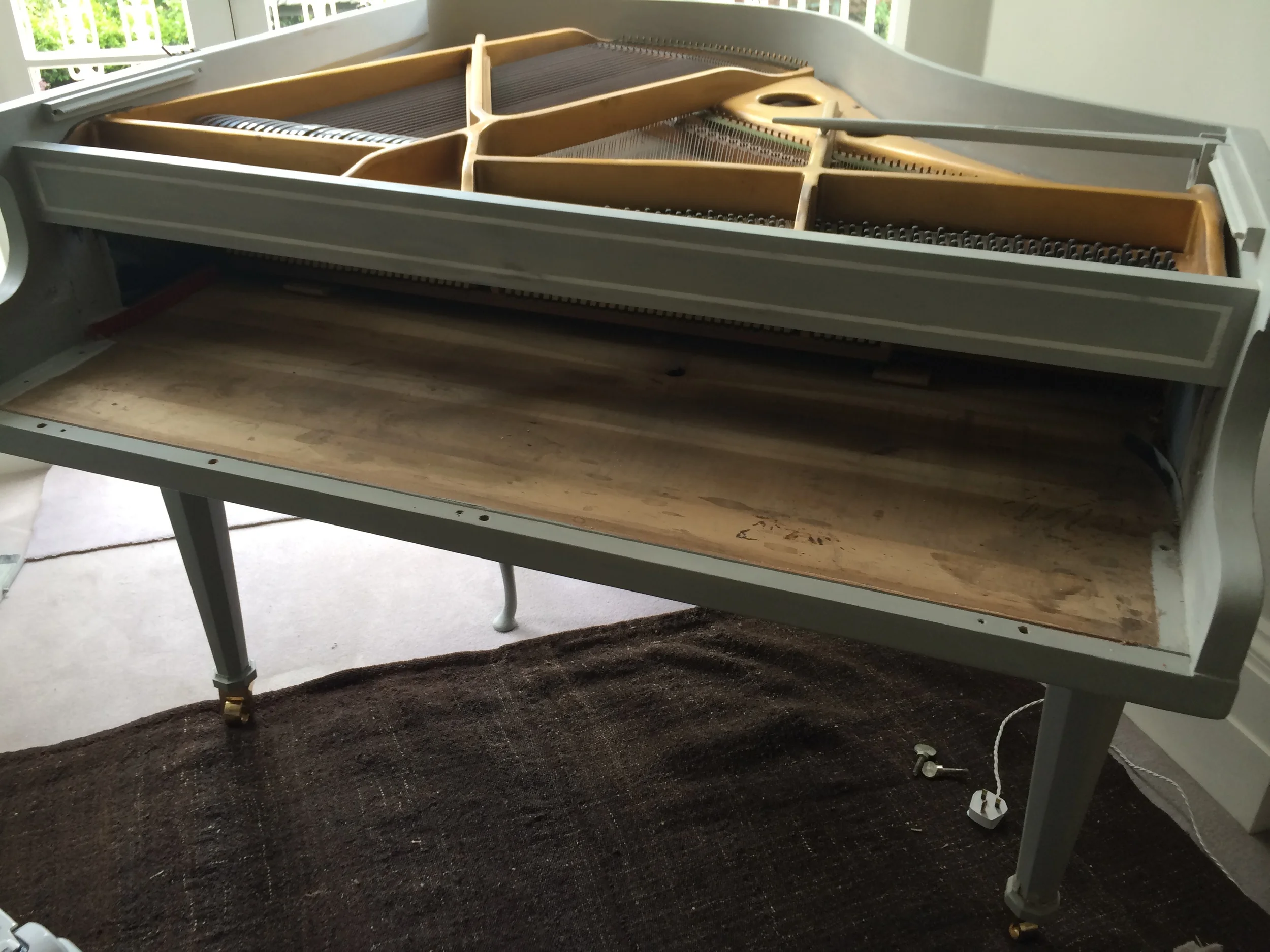 Cleaning old grand piano