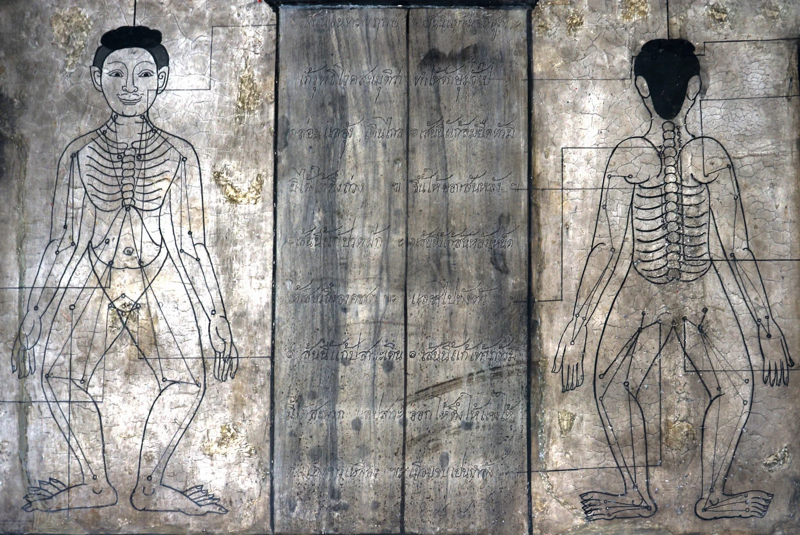 acupuncture point ancient wood carving.jpg
