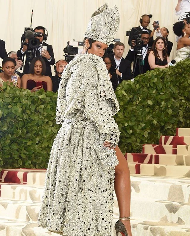 &ldquo;It's literally a given that everyone strives to out dress Rihanna but many to all fall quite short. The Bajan beauty arrived in a custom Maison Margiela gown and overcoat designed by John Galliano that left jaws dropping and the internet abuzz