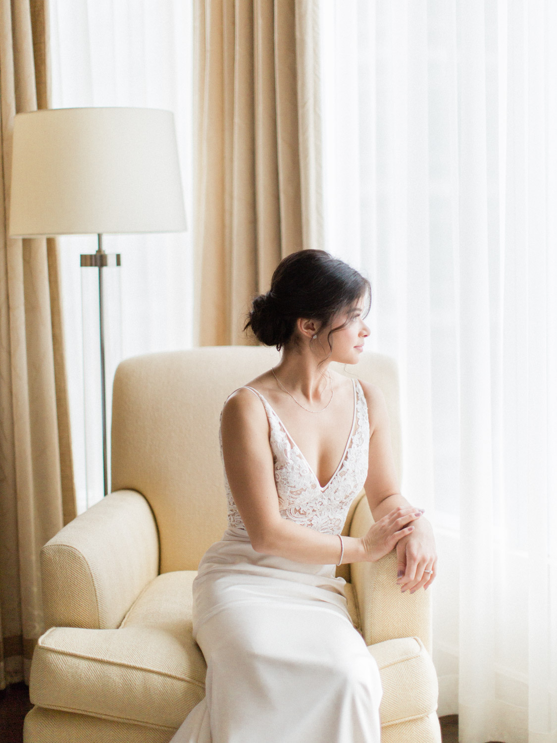 - Natural, candid photograph of bridesmaids and bride getting ready for a winter wedding at Ritz Carlton in Toronto. Captured by Toronto wedding photographer Corynn Fowler Photography.