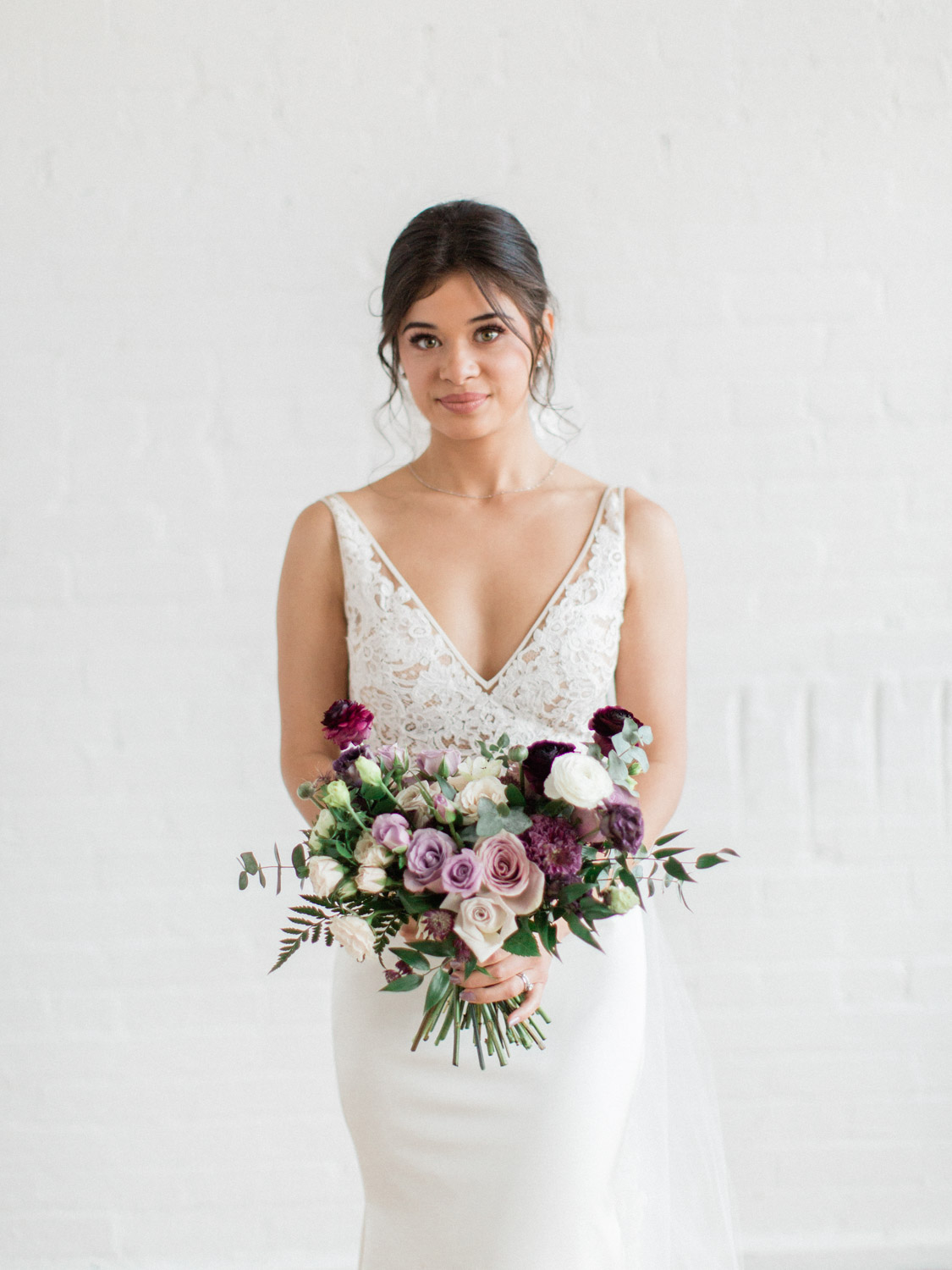 Fine art portrait of a bride with flowers. Captured by Torono wedding photographer Corynn Fowler Photography