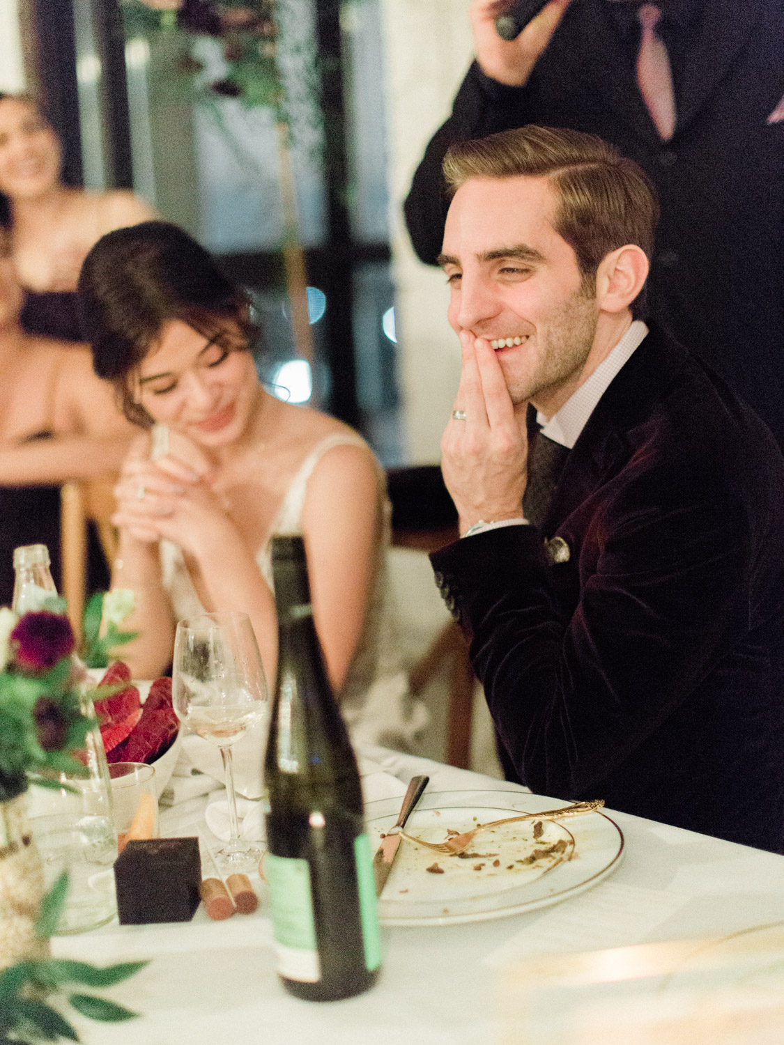Candid wedding photograph of guests, bride and groom enjoying the reception at Italian wedding at The Burroughes. Captured by Toronto wedding photographer Corynn Fowler Photography.