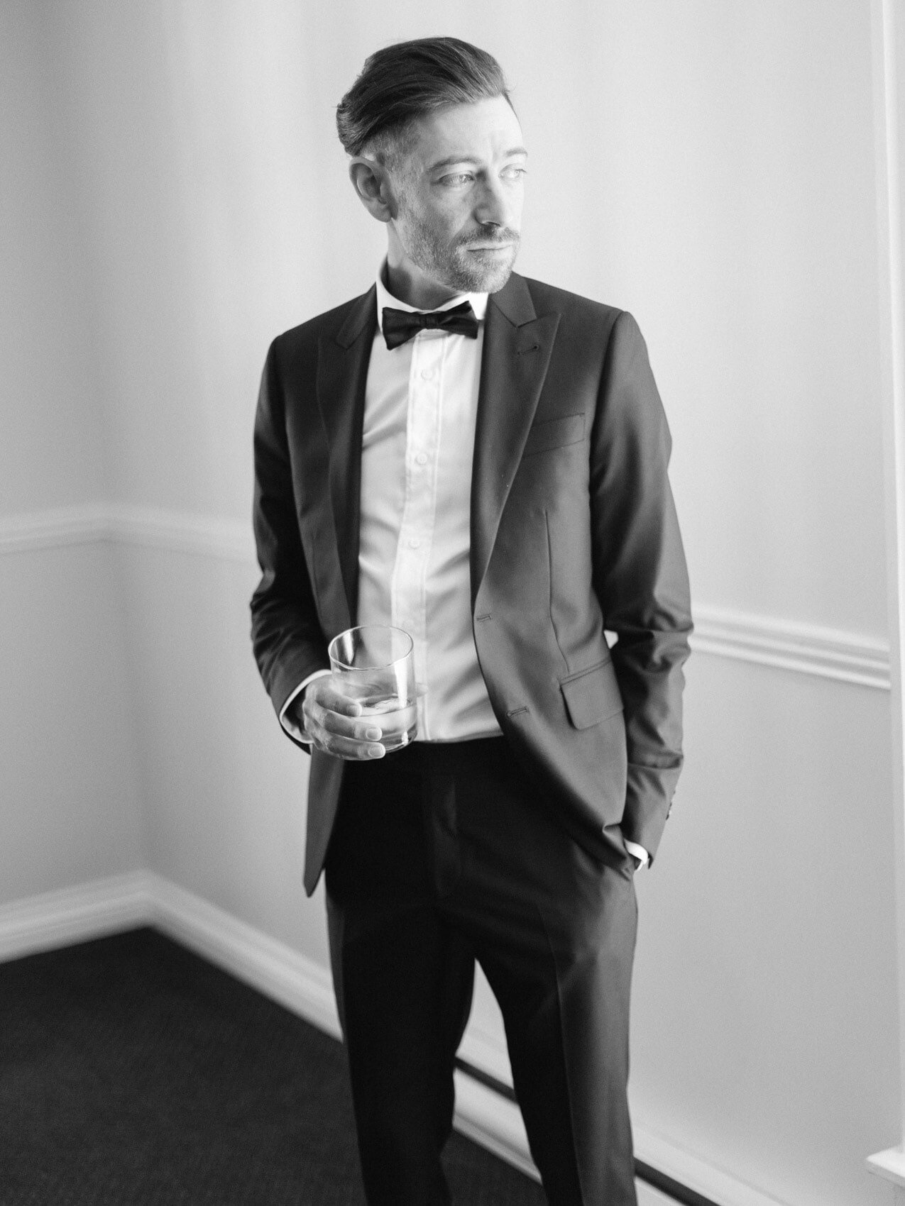 groom getting ready for his wedding at windermere house in muskoka