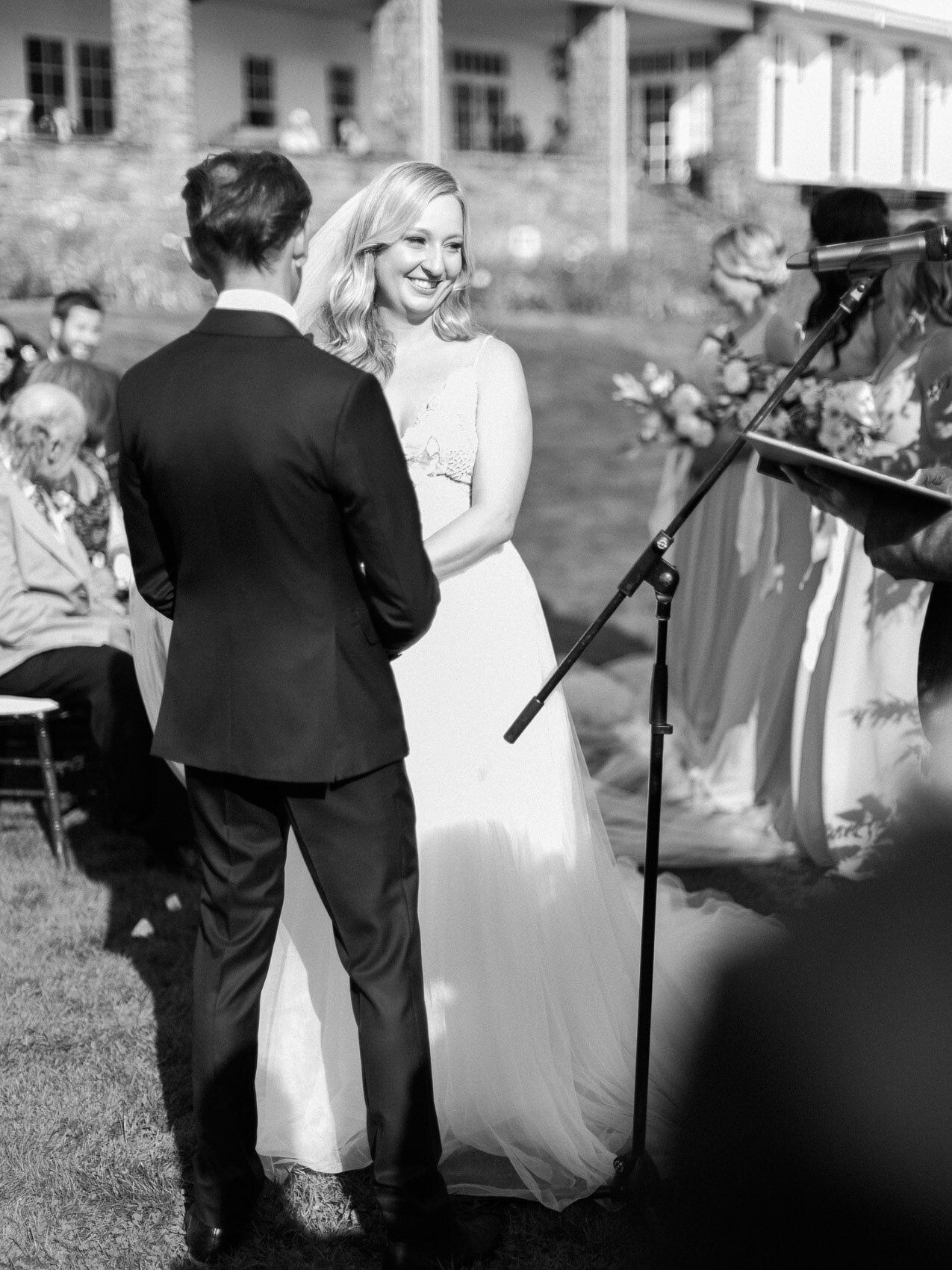 natural candid photo of the bride and groom at their outdoor wedding ceremony at windermere house muskoka