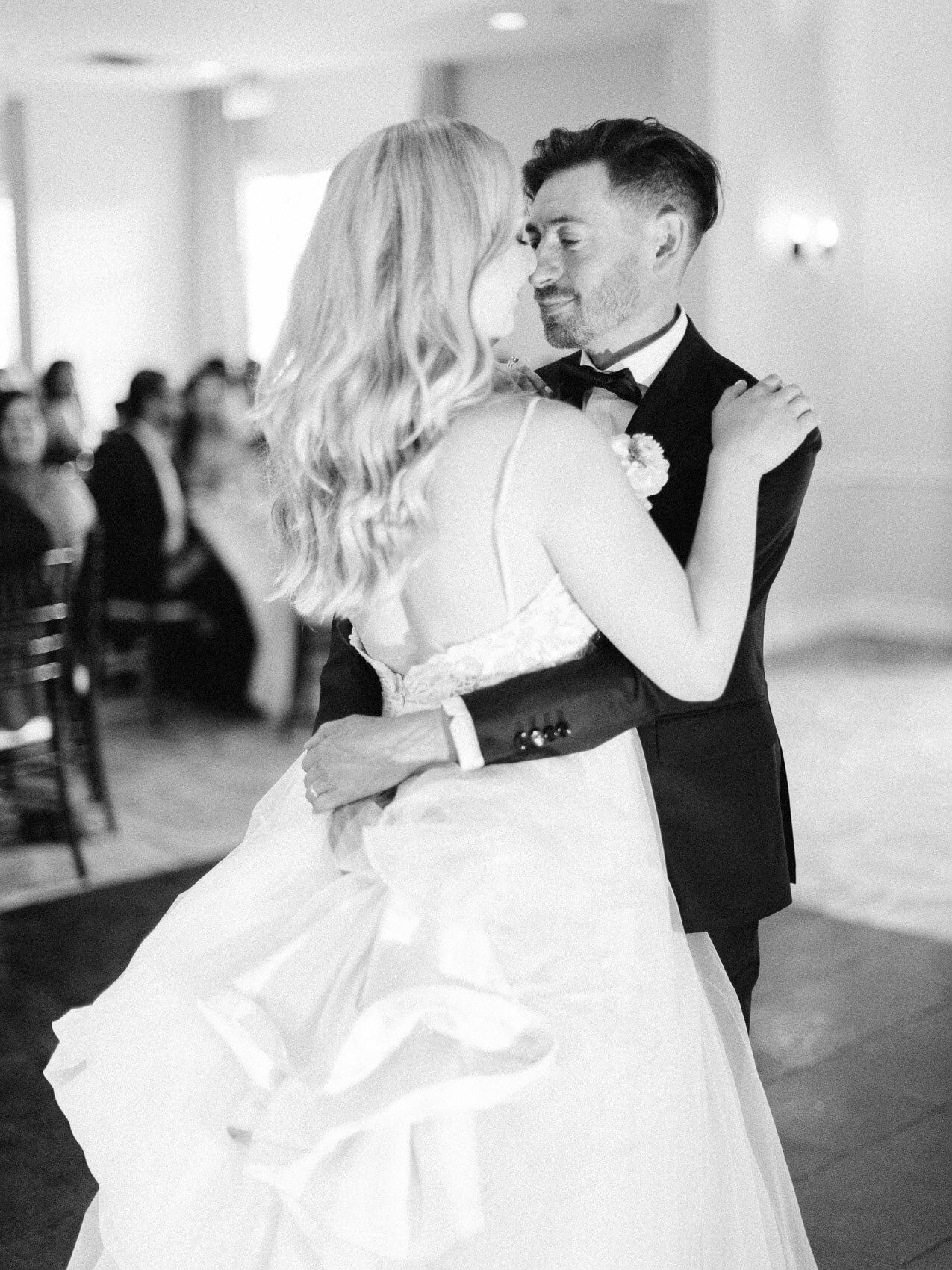 bride and groom's candid first dance at their wedding reception at windermere house muskoka
