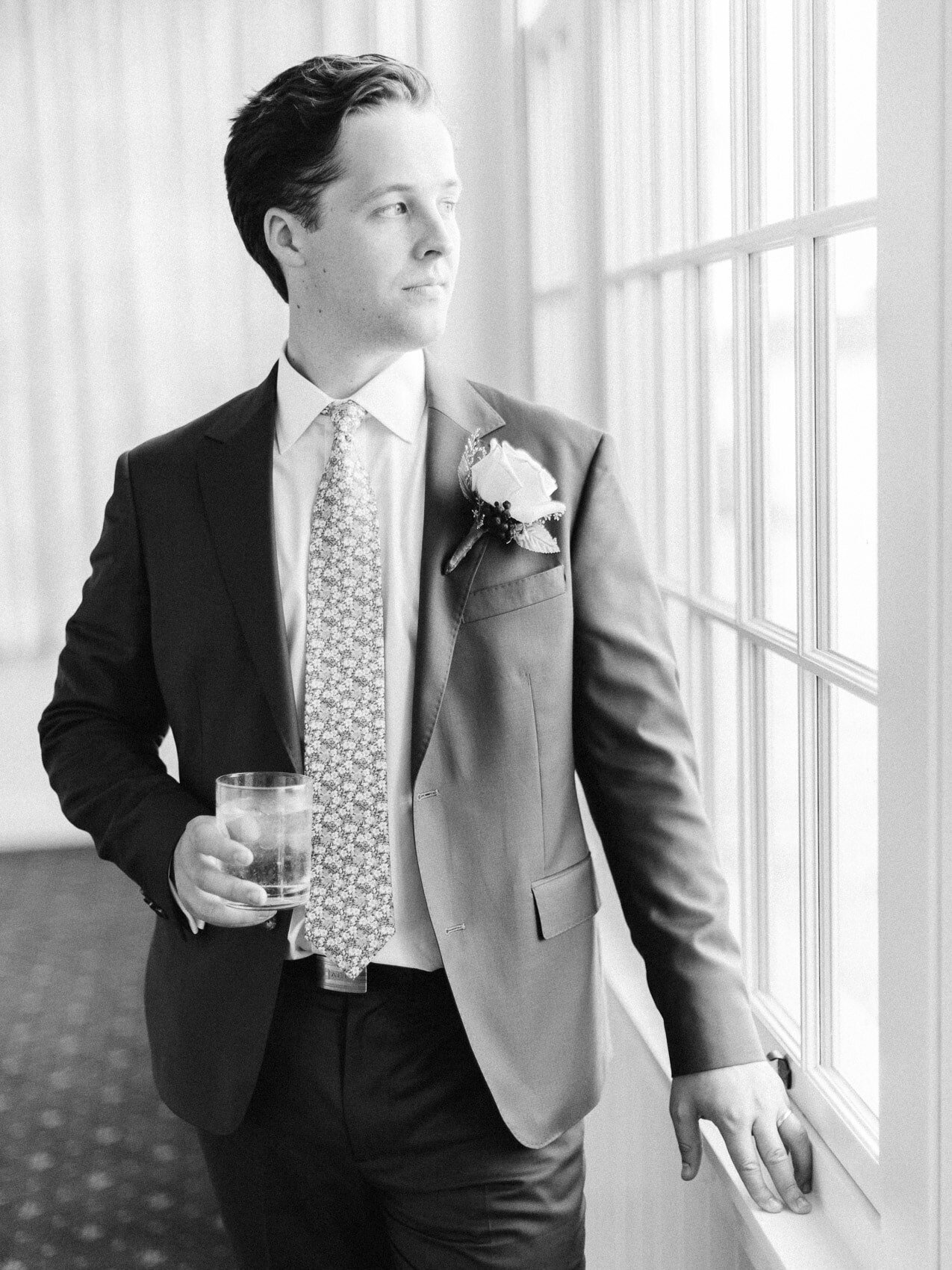 groom posing naturally for a candid happy photograph at the rcyc toronto